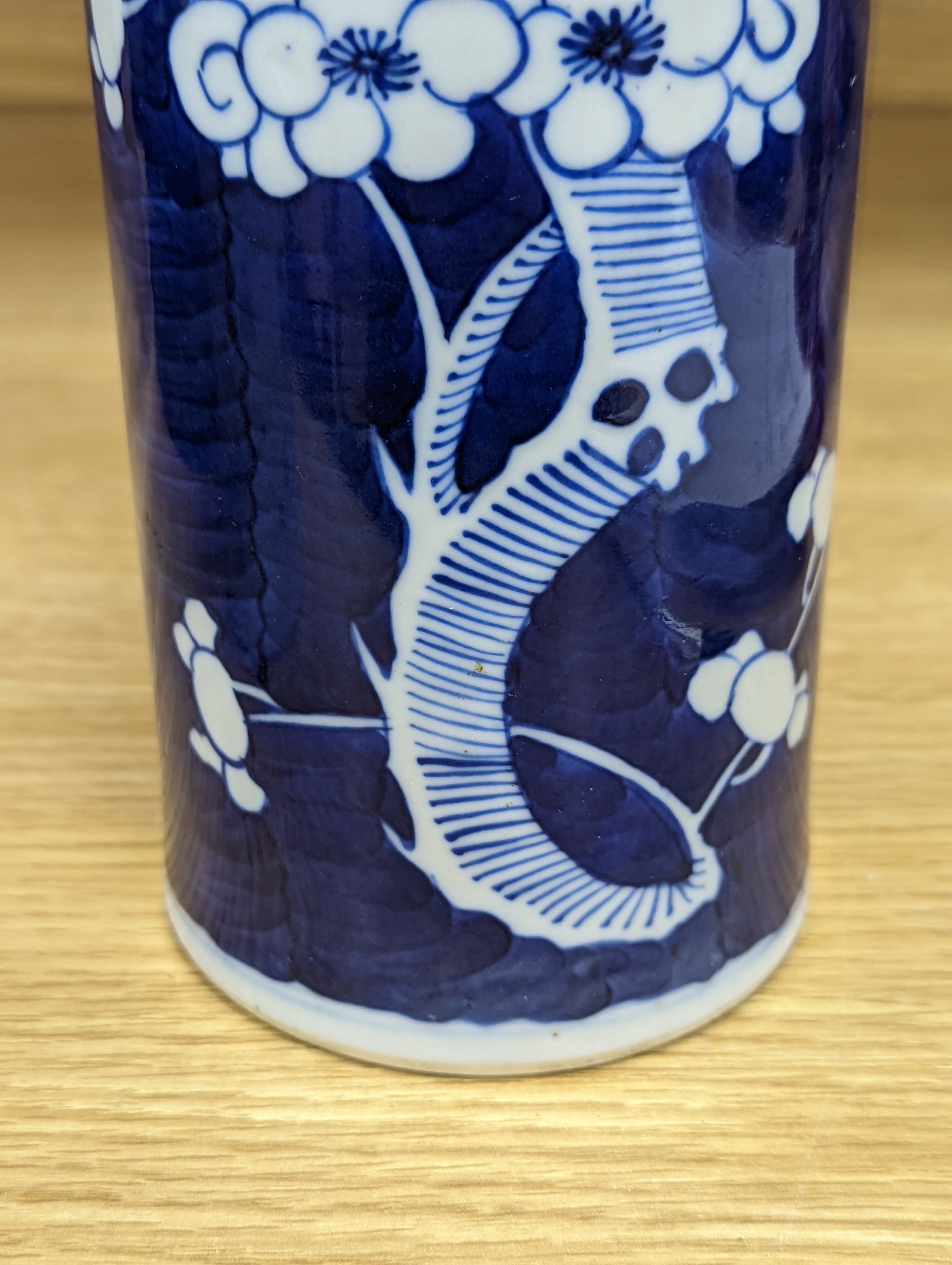An 18th century Chinese famille rose mug, a Chinese Imari tea caddy and two Chinese blue and white sleeve vases 30cm (4)